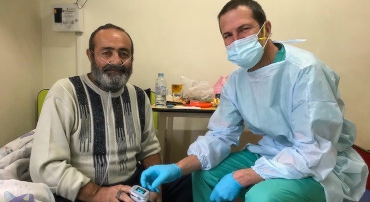 Emergency Medicine Consultant Paul Ransom is pictured here at Nork hospital with one of his patients, Miquel, who is 63.