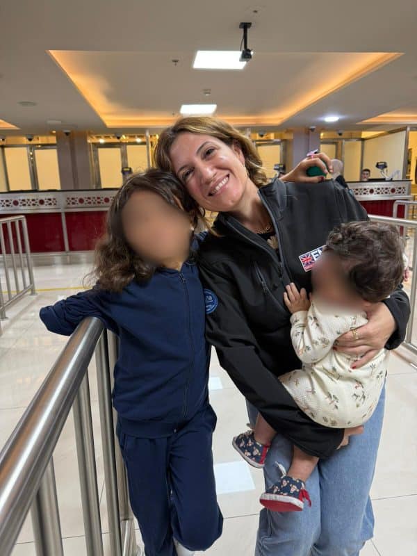 Diana Maddah, UK-Med Senior Health Advisor, with some of the Palestinian children on the first medevac flight to the UK.